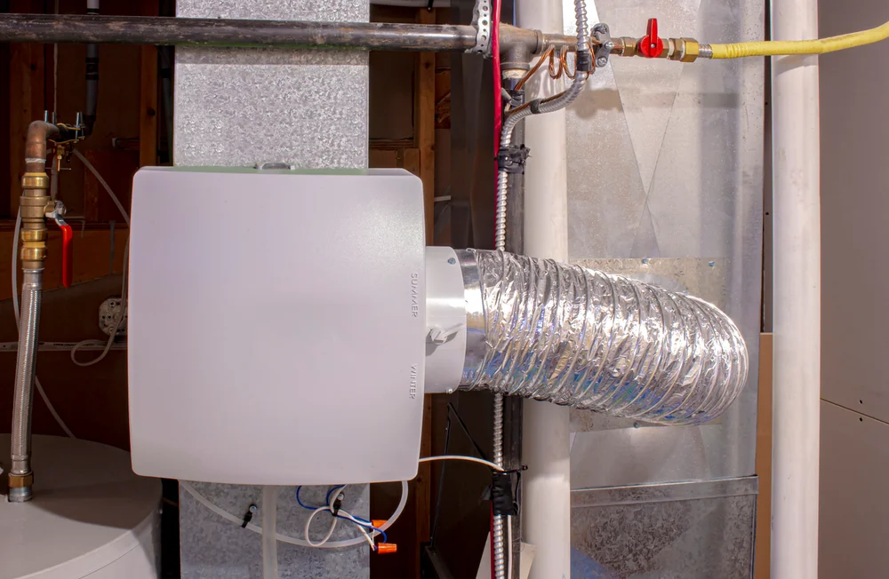 Whole-home ventilation system connected to ductwork in a Wilson, NC attic or utility space.