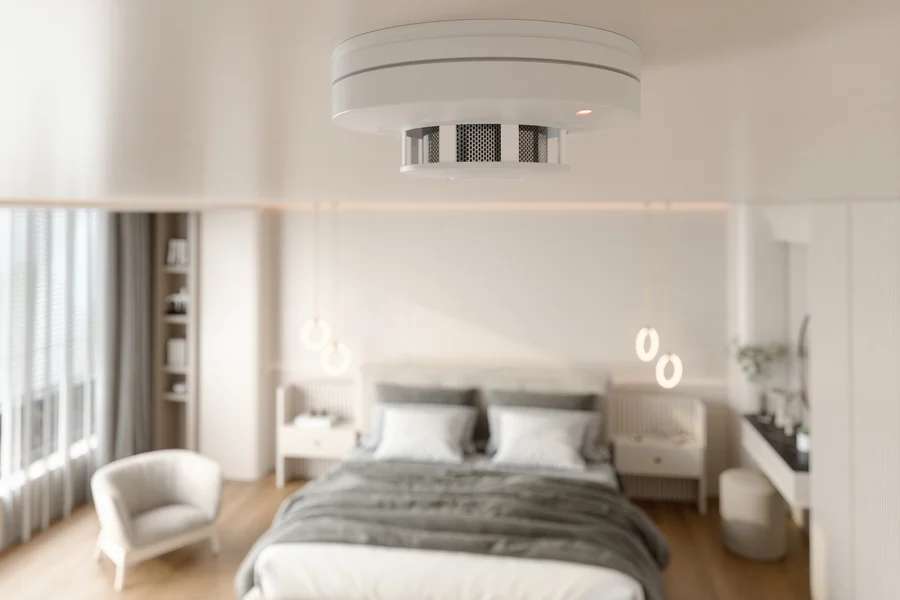 Modern smoke carbon monoxide detector mounted on ceiling for home safety in Wilson, NC.