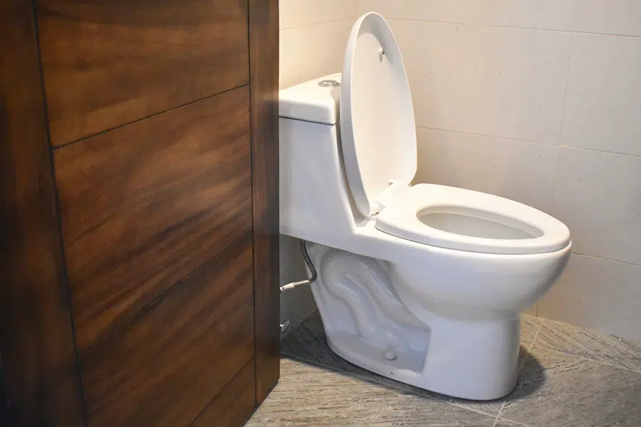 Clean white toilet installed in a modern bathroom in Wilson, NC.