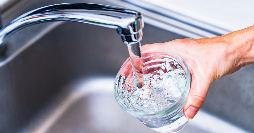 Fresh filtered tap water pouring into a glass inside a Wilson, North Carolina home.