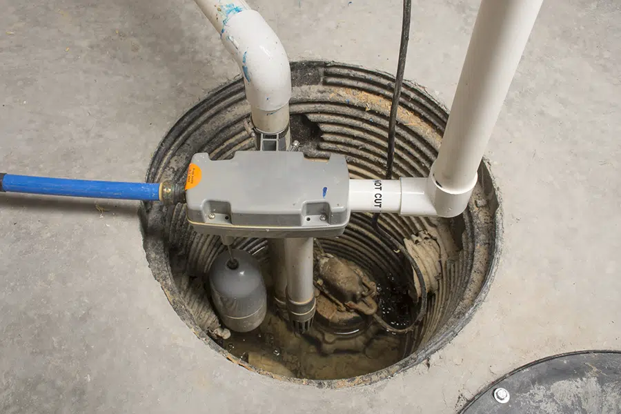 Basement sump pump system installed in a pit for flood prevention in a Wilson, North Carolina home.