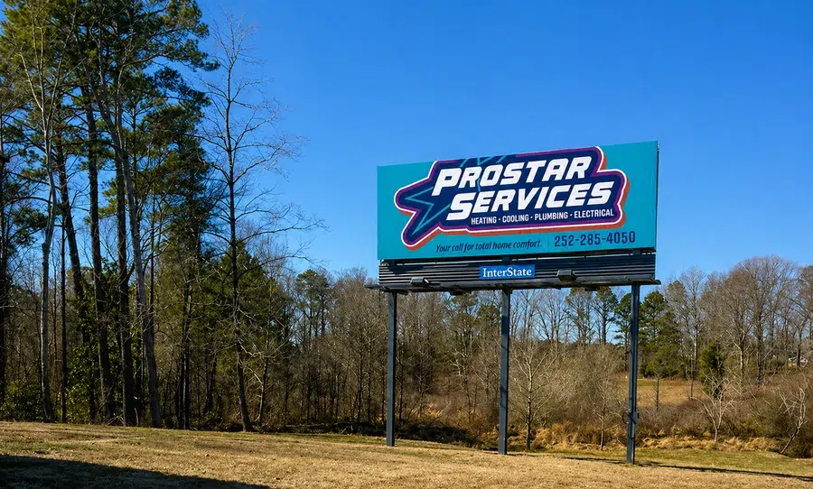 Prostar Services billboard promoting heating, cooling, and electrical services near Wilson NC