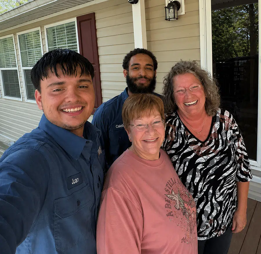 Prostar Services team smiling with satisfied homeowners after HVAC and plumbing service appointment in the Wilson, NC area
